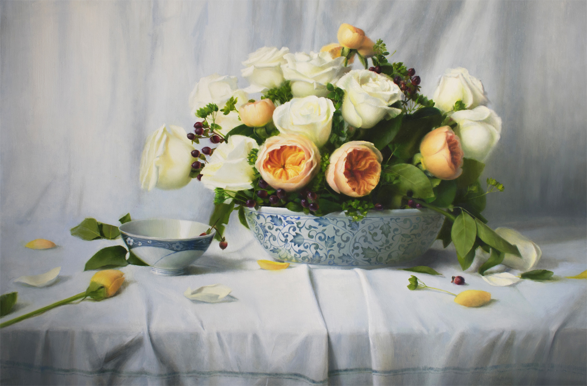 White and peach roses in a blue and white bowl